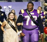 Homecoming Queen Britney Cuevas and King Isaiah Mack enjoy the spotlight at halftime of Lemoore's annual Homecoming Game.